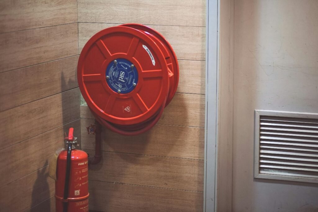fire extinguisher and a hose reel inside a building