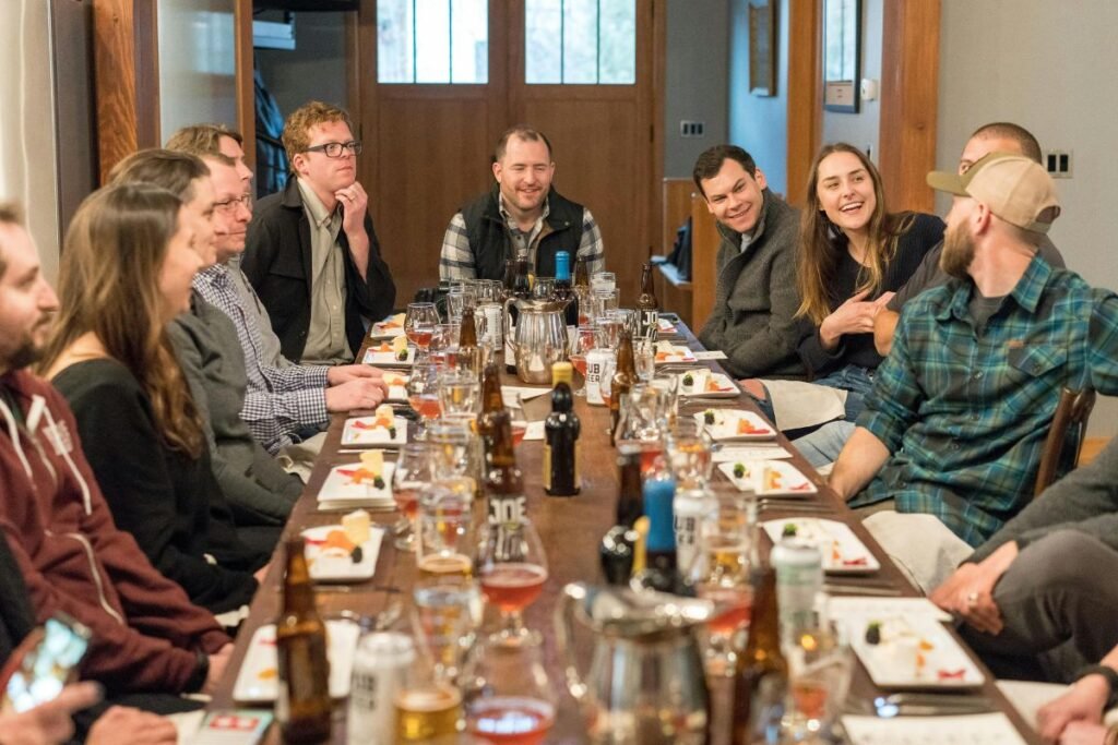 group of people sitting on a dining table